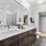 well lit bathroom with access to walk-in closet