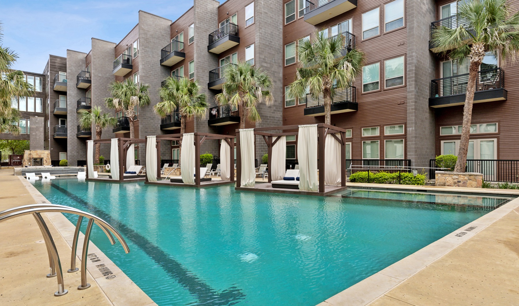 Pool in courtyard with poolside cabanas