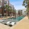 a swimming pool in a courtyard between buildings