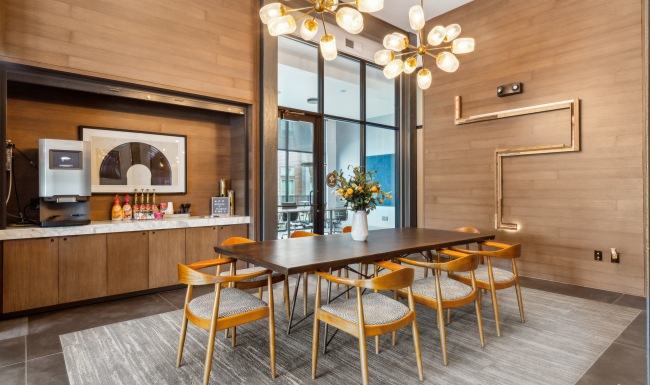 Settle into comfort at The Lookout Coffee Bar next to long table with chairs