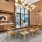 coffee counter next to a long table surrounded by chairs