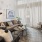 curtains cover a massive window in furnished living room