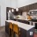 a kitchen with pendant lights over island countertop