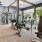 a well lit gym with exercise equipment