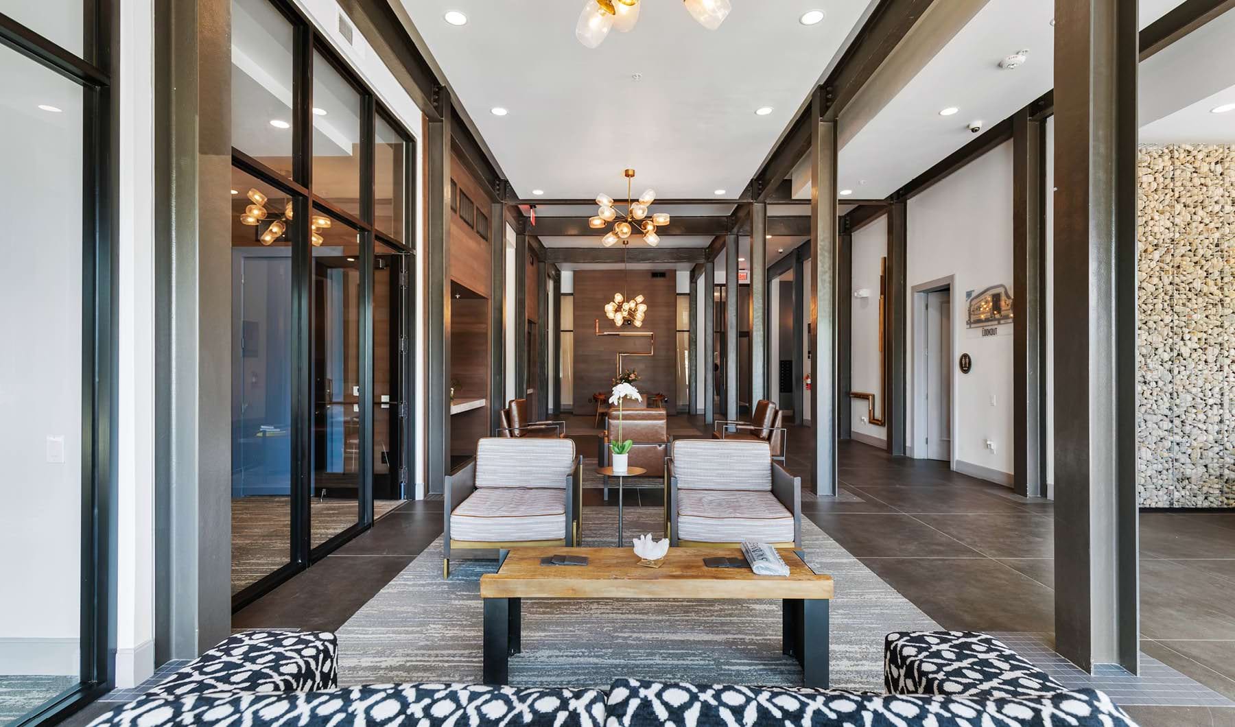 Perfect Blend of Sophistication and Comfort luxurious lobby with chandeliers, a table and chairs